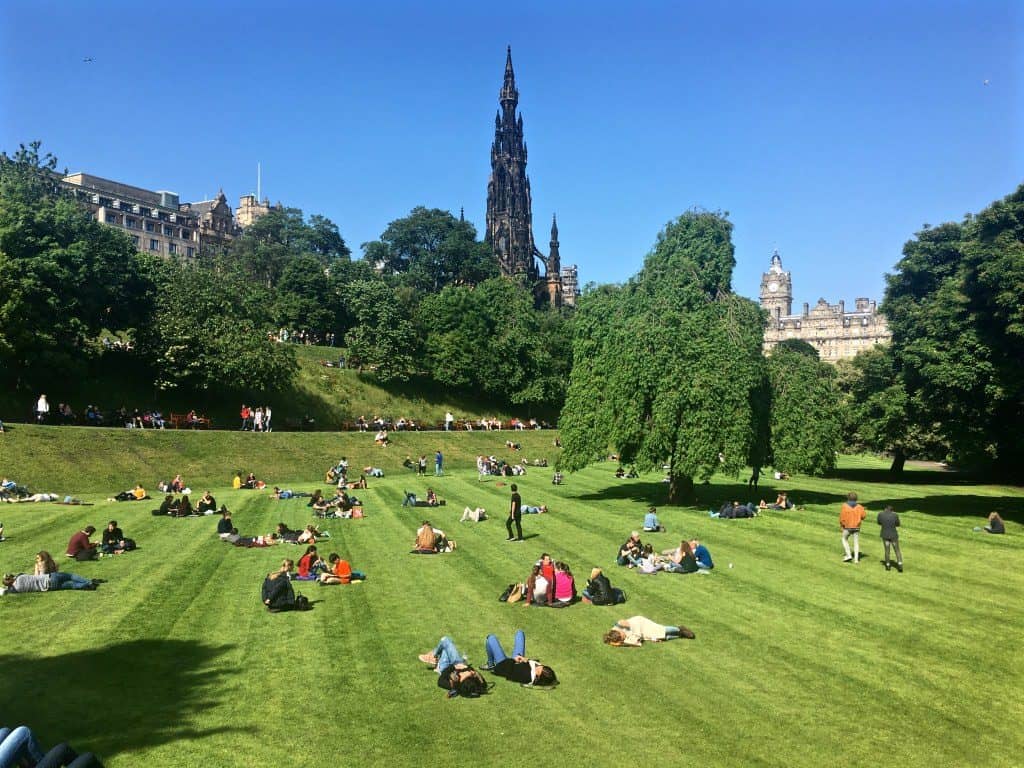 Princes Street Gardens Edinburgh people lying in the sunshine