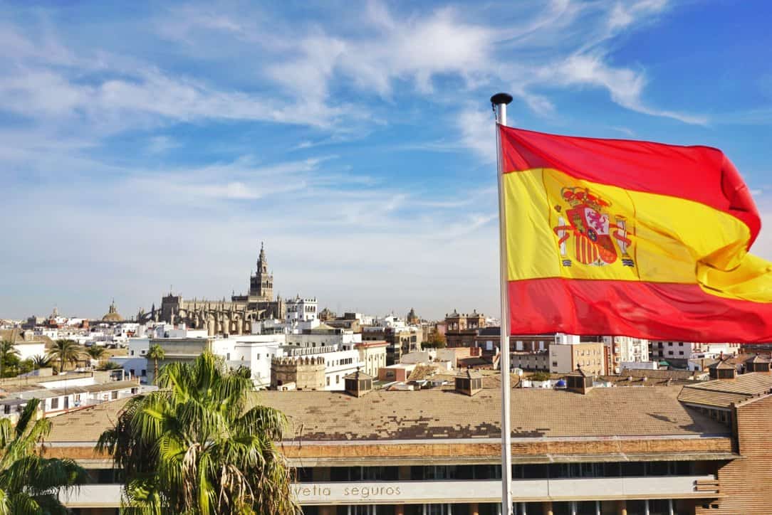Spain in winter - Seville skyline and Spanish flag