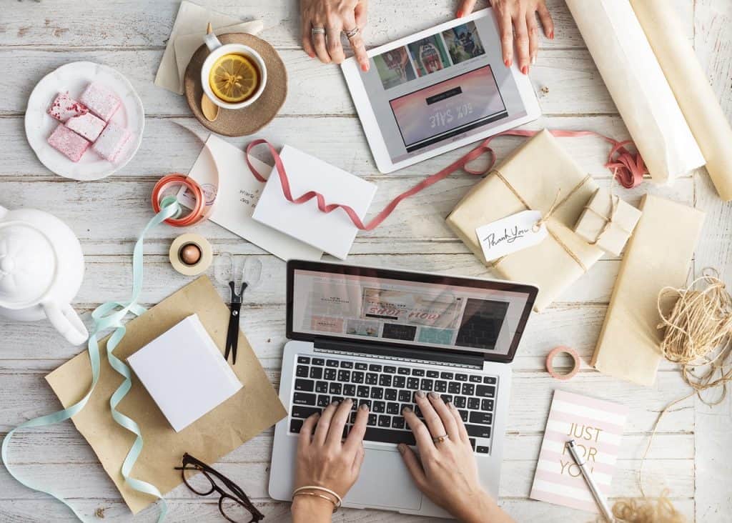 Best Blogging Gifts - Laptops and craft supplies on a desk. 