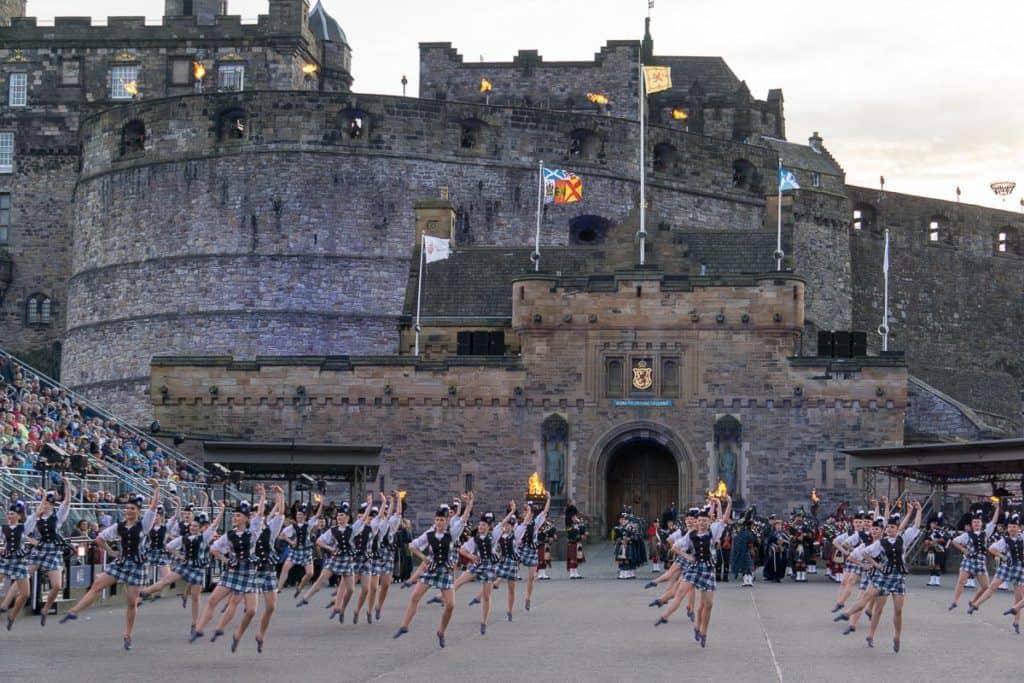 Edinburgh Festivals August - Edinburgh Tattoo pipe bands and dancers in front of Edinburgh Castle