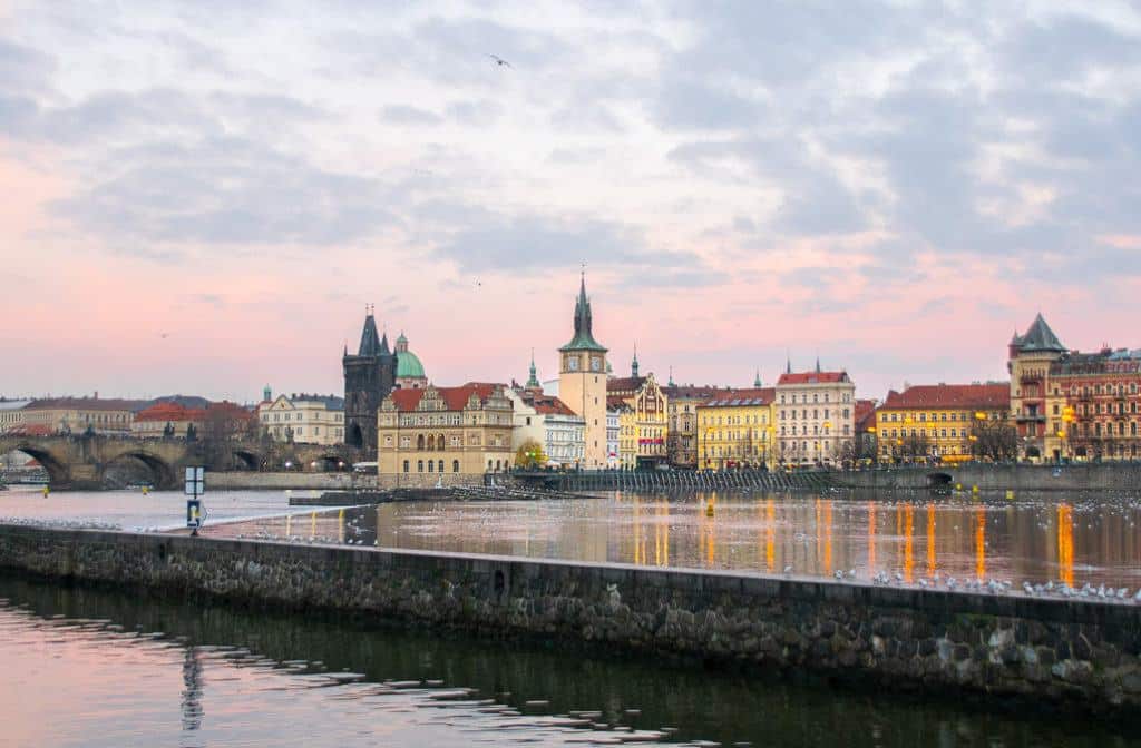 Babymoon Destinations Europe-Prague Czech Republic - View of city skyline across the river at sunset