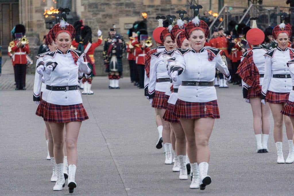 Edinburgh Military Tattoo - Marching Girls in lines in front of Edinburgh Castle and military band