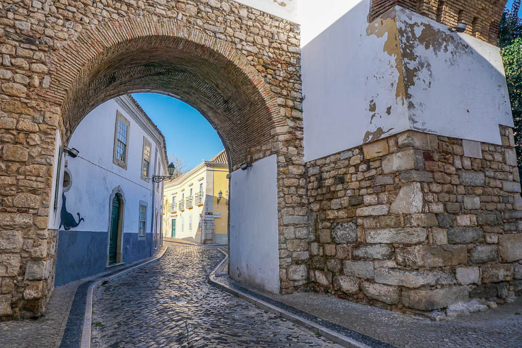 Gateway to cobblestone street Faro in winter