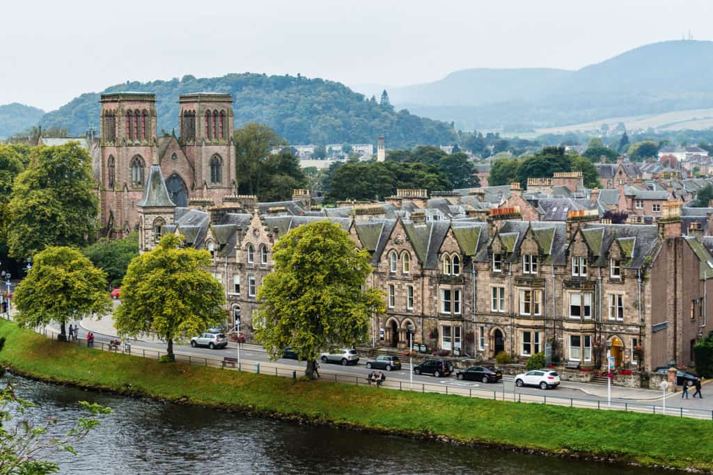 View over Inverness street with houses and mountains behind - Things to Do in Inverness with Kids