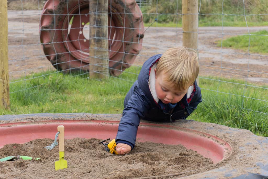 Jacksons at Jedburgh - Toddler playing in sandpit