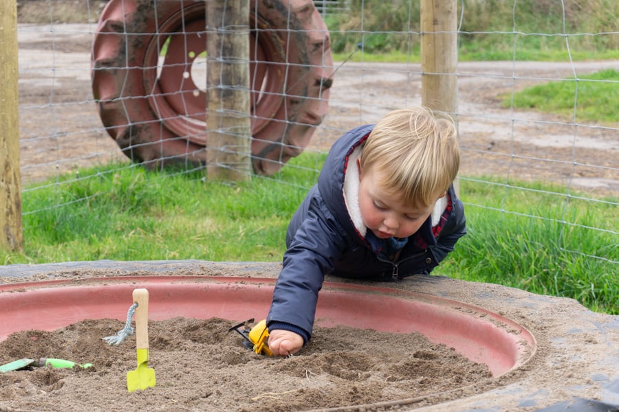 Jacksons at Jedburgh - Toddler playing in sandpit