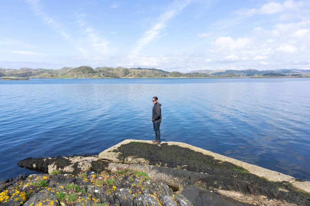 Starting a Business in 2020 - Standing on a rock by the sea at Argyll, Scotland