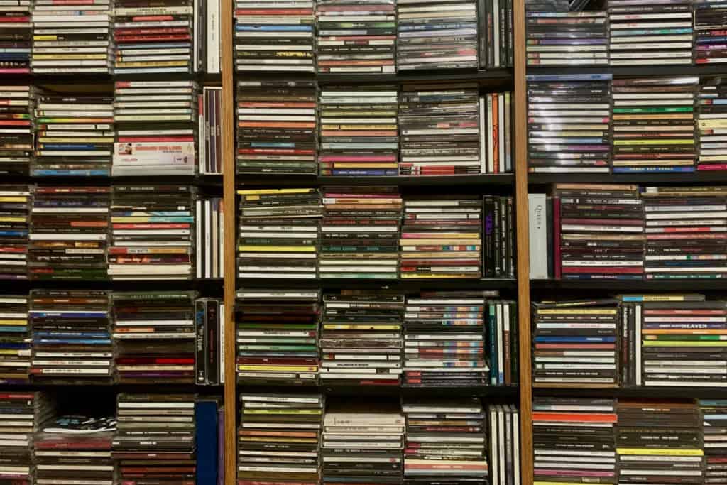 Stacks of CDs in a bookcase