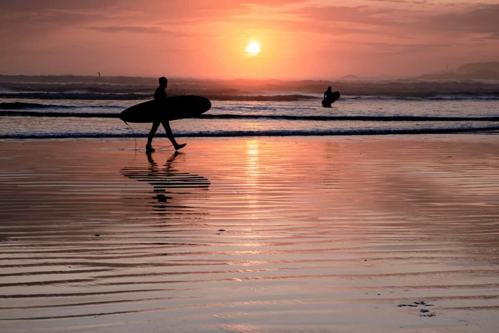 Things to do in Tofino, Vancouver Island - surfer and sunset