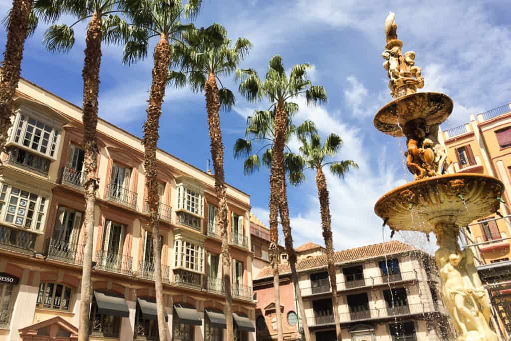 Is Malaga Worth Visiting? - fountain and palm trees in Malaga